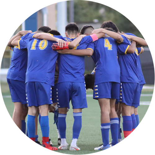 Soccer Players in Huddle